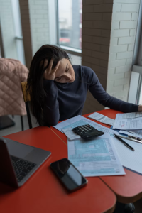 A tax professional and Massachusetts business owner reviewing equipment purchase plans under the OBBBA bonus depreciation 2026 rules.